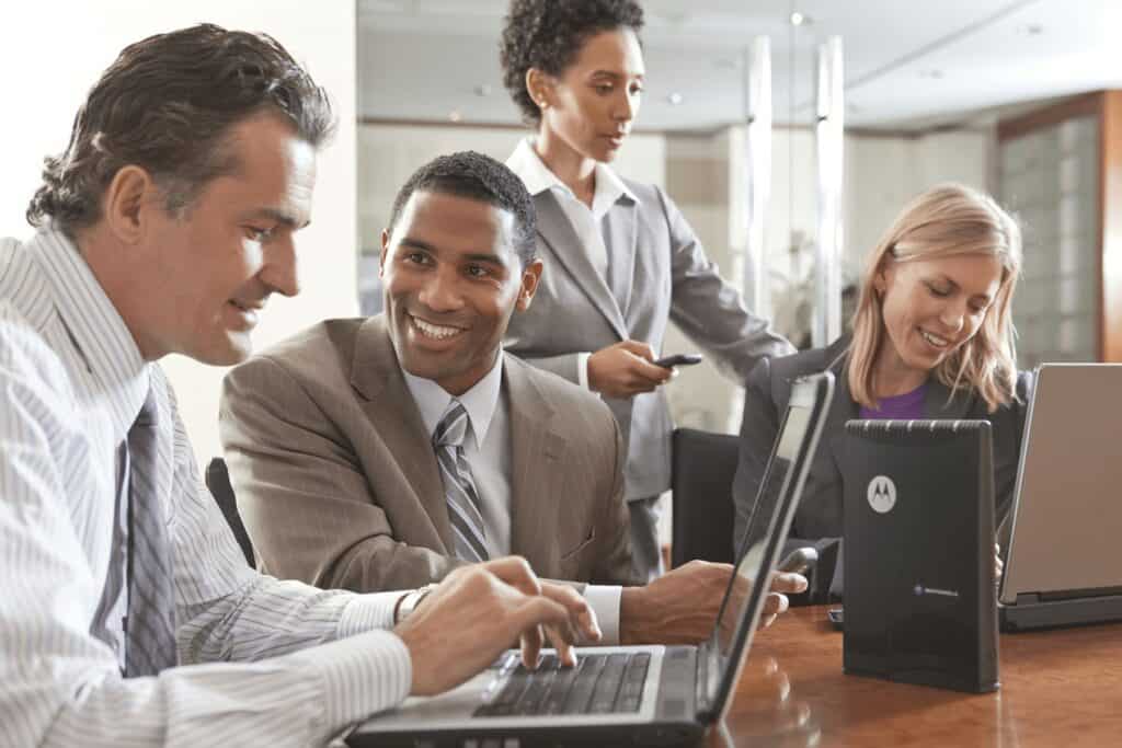 Office team working together at a conference table.